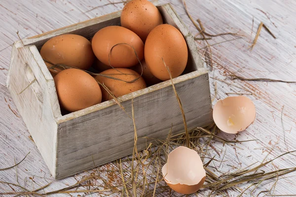 Chicken eggs on wooden background — Stock Photo, Image