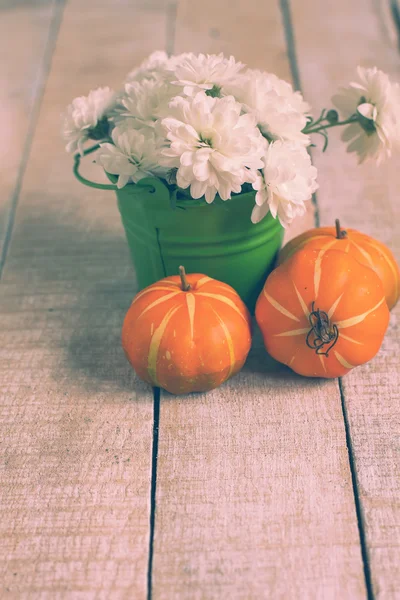 Autumn flowers on table — Stock Photo, Image