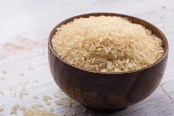 Rice in wooden bowl — Stock Photo, Image