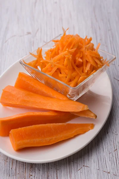 Grated carrots on board — Stock Photo, Image