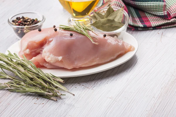 Fresh chicken on wooden table