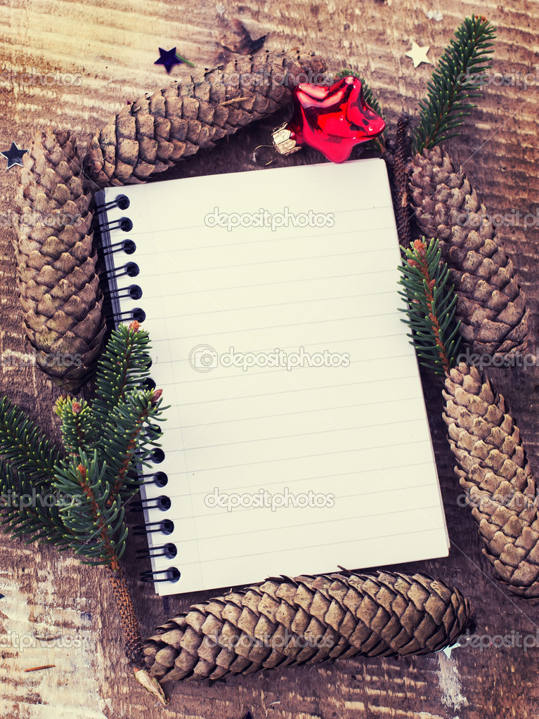 Christmas decorations and empty notebook