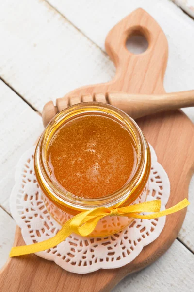 Fresh honey in glass bank — Stock Photo, Image