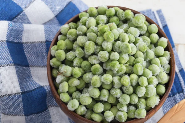 Frozen peas in bowl — Stock Photo, Image