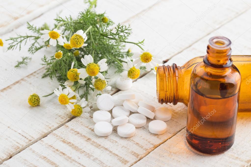 Concept homeopathy. Bottles with medicines and natural herbs.