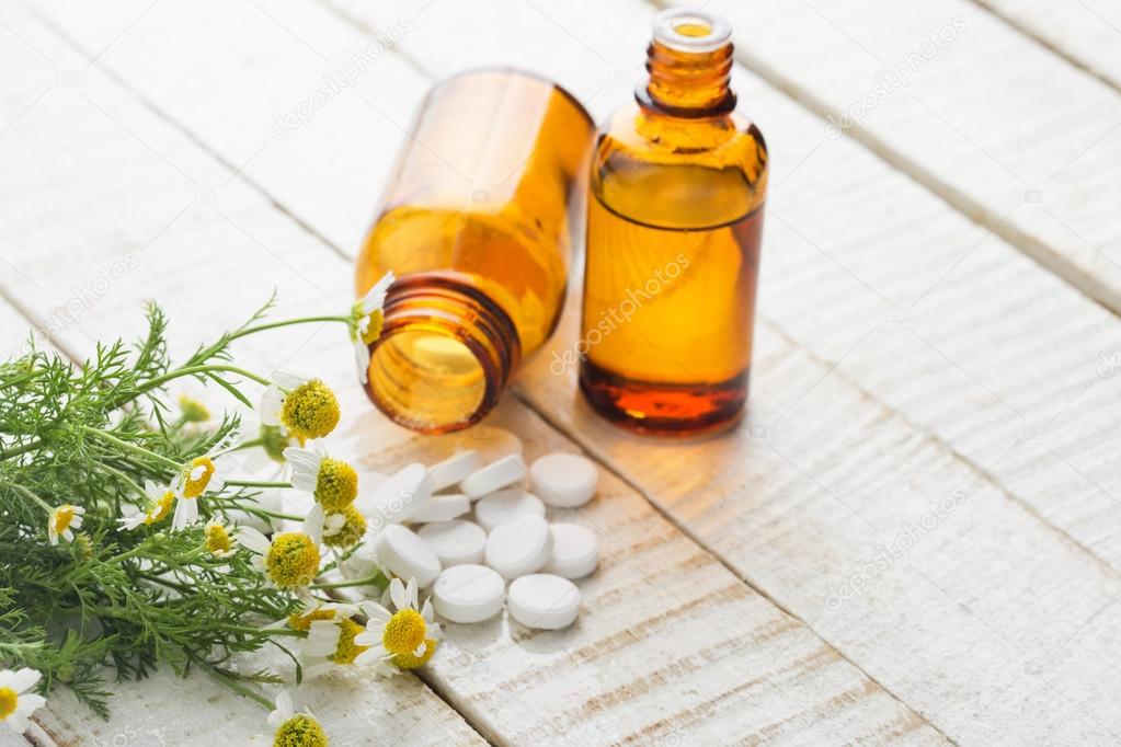 Herbs and bottle with medicines. Concept homeopathy.