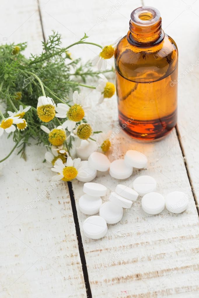 Concept homeopathy. Bottle with medicines, pills, herb.