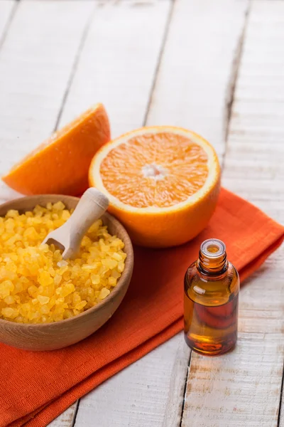 Essential aroma oil and sea salt with orange — Stock Photo, Image