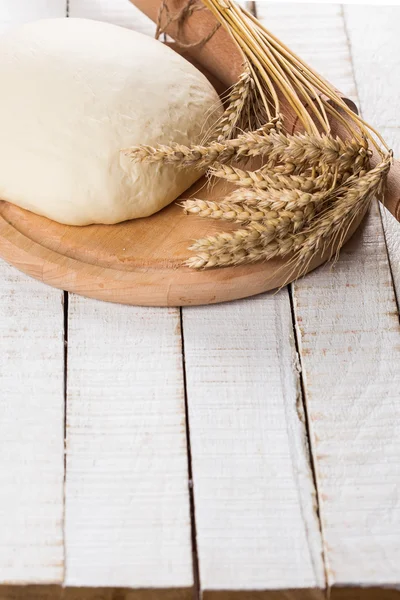 Dough on wooden board — Stock Photo, Image