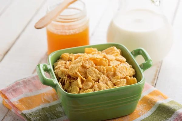Cornflakes in bowl on table — Stock Photo, Image