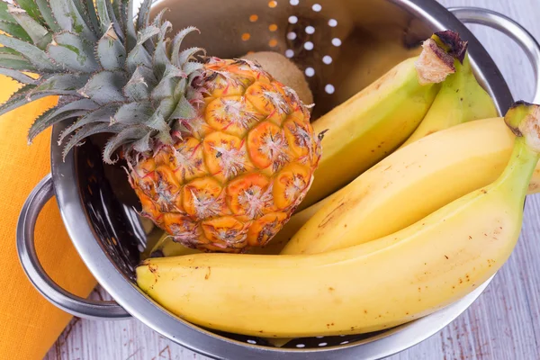 Fresh pineapple ana bananas in bowl — Stock Photo, Image