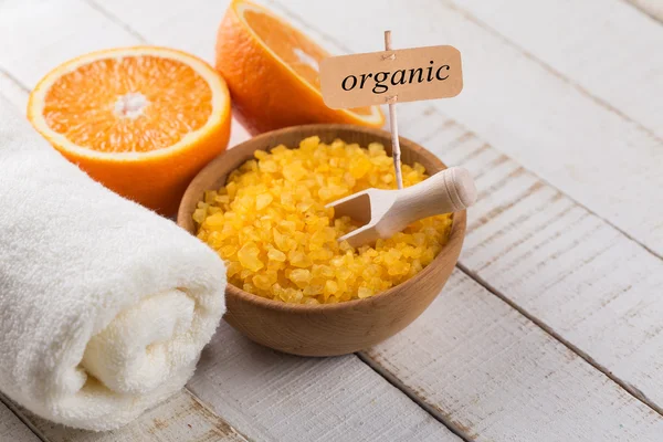 Sea salt in bowl with oranges — Stock Photo, Image