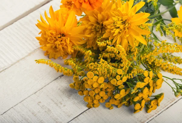 Autumn flowers on table — Stock Photo, Image