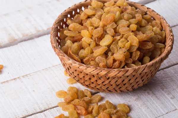 Raisins on wooden background — Stock Photo, Image