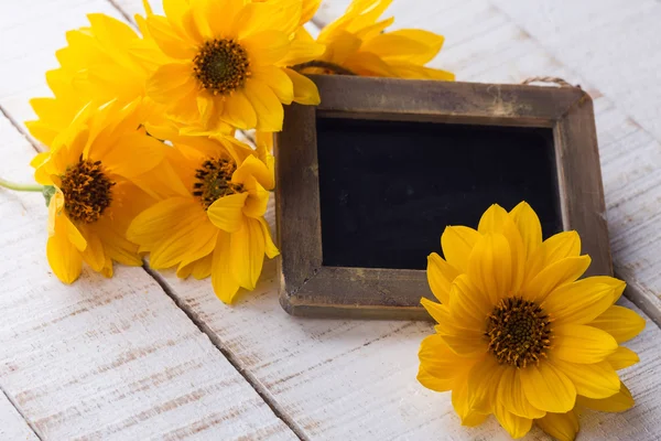 Autumn flowers on table — Stock Photo, Image