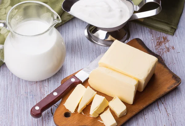 Mantequilla, leche, crema agria . — Foto de Stock