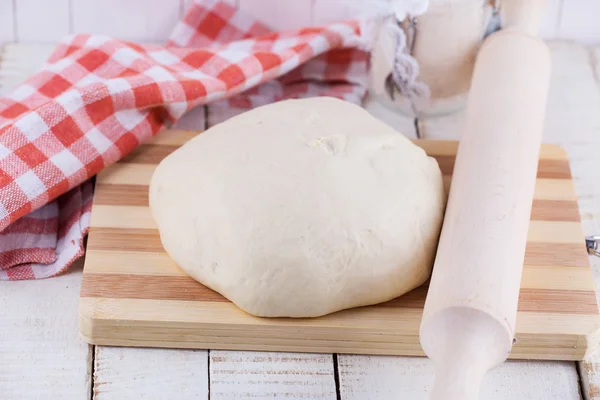 Dough on wooden board — Stock Photo, Image