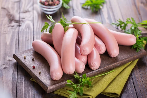 Sausages on board — Stock Photo, Image