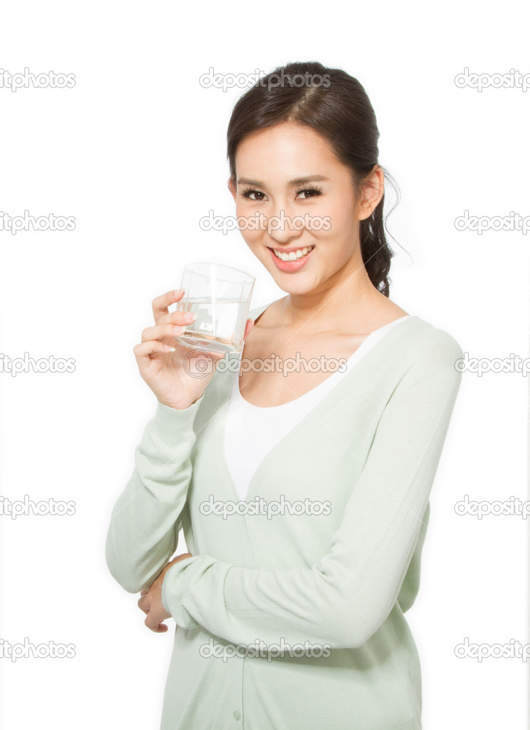 Asian woman drinking a glass of water
