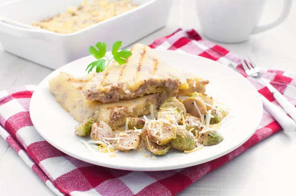 Polenta and brussels sprouts dinner — Stock Photo, Image