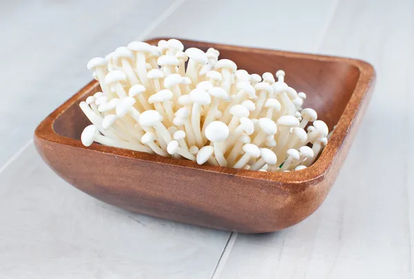 Raw exotic enoki mushrooms — Stock Photo, Image