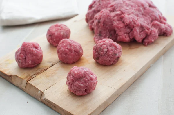 Ground meat and meatballs raw uncooked — Stock Photo, Image