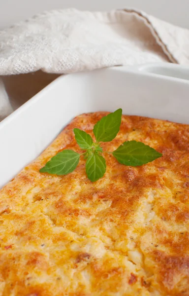 Dish with cheese and herbs — Stock Photo, Image