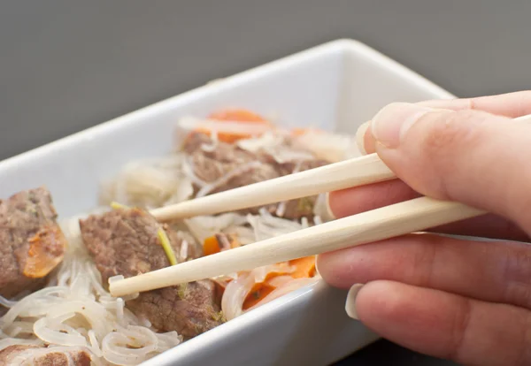 Eating asian meat — Stock Photo, Image