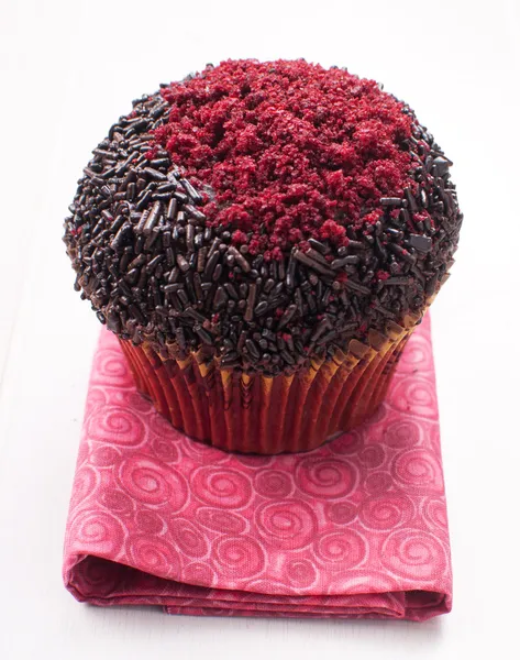 Muffin decorated with red sugar — Stock Photo, Image