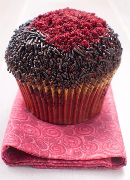 Red and chocolate decorated muffin — Stock Photo, Image