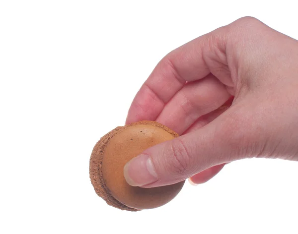 Macarrón galleta mujer sosteniendo en la mano — Foto de Stock