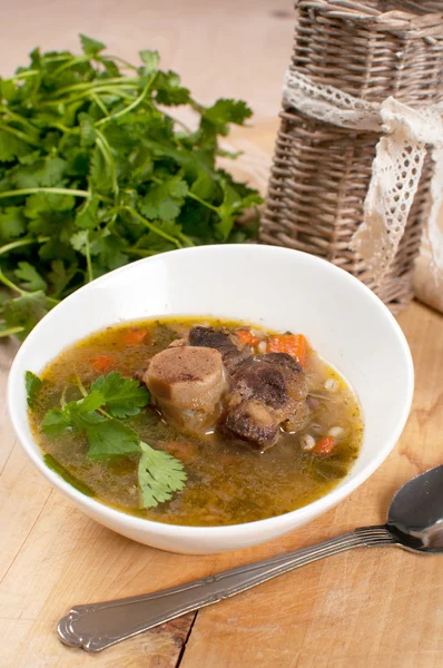 Beef tail soup with parsley and barley — Stock Photo, Image
