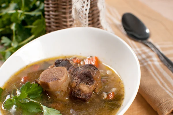 Ox tail soup with barley — Stock Image Ox tail soup with barley Stock Photo