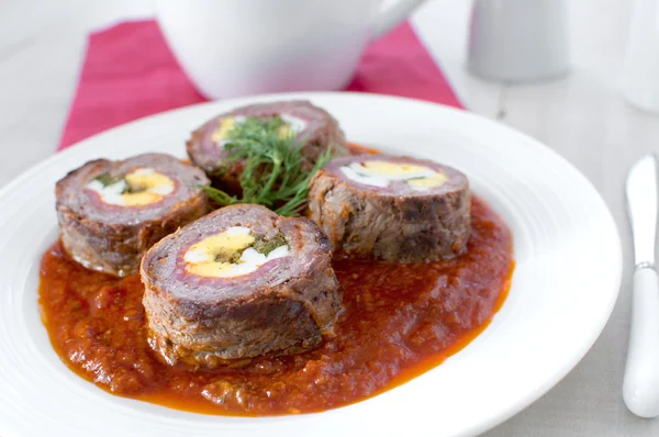 Beef roulade with eggs in tomato sauce — Stock Photo, Image