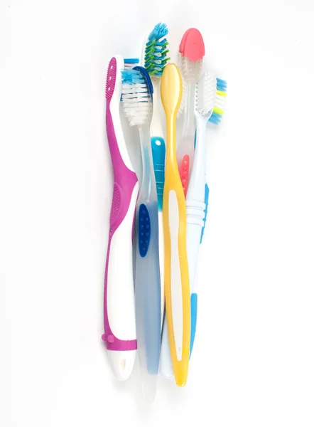Mucchio di diversi spazzolini da denti — Foto Stock