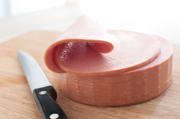 Bologna sausage thin sliced cut — Stock Photo, Image