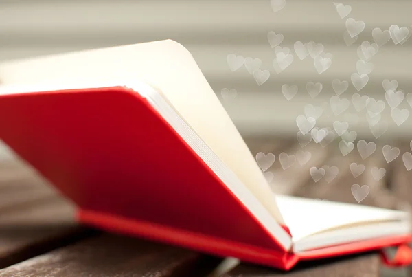Hearts flying out of notebook — Stock Photo, Image