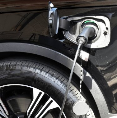 Bologna - Italy - April 30, 2022: Enel connection socket at the charging station. Refueling for cars e-mobility. Electric care charging