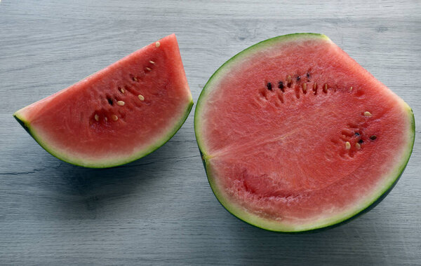 Fresh watermelon isolated on wooden table.