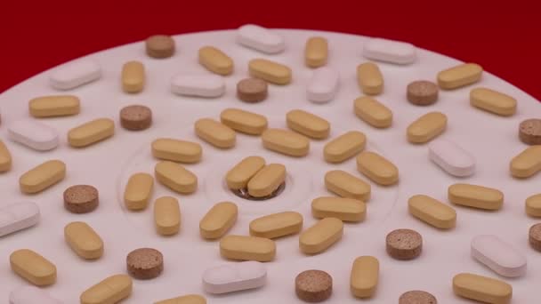 Lot Pills Rotating Display Isolated Red Background — Vídeo de Stock