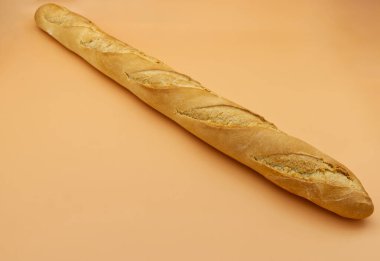 French Baguette Bread isolated on orange background
