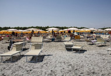 Punta Marina Terme, Ravenna - Italy - August 17, 2022: : Italian beach view with umbrellas and sunbeds. Summer day on the beach. Riviera Romagnola, Italy