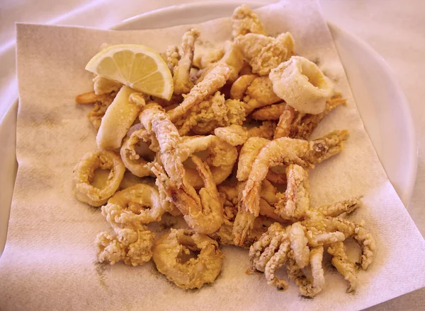 Traditional Italian dish: Frittura di pesce mista or Fritto di pesce misto. Mixed fried local seafood. Riviera Romagnola, Italy