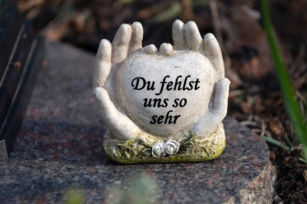 Two Hands Heart Stone German Words Sorrow — стоковое фото