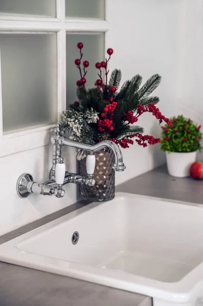 Kitchen details, sink, faucet, window, place for text. Kitchen decor for Christmas, New Year..