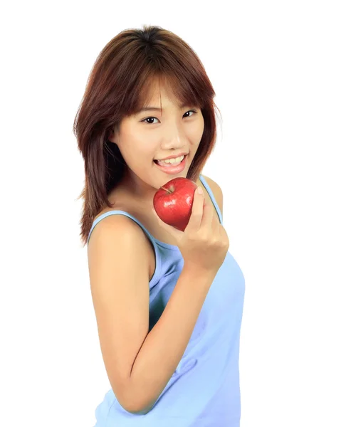 Isolierte junge asiatische Frau mit einem roten Apfel. — Stockfoto
