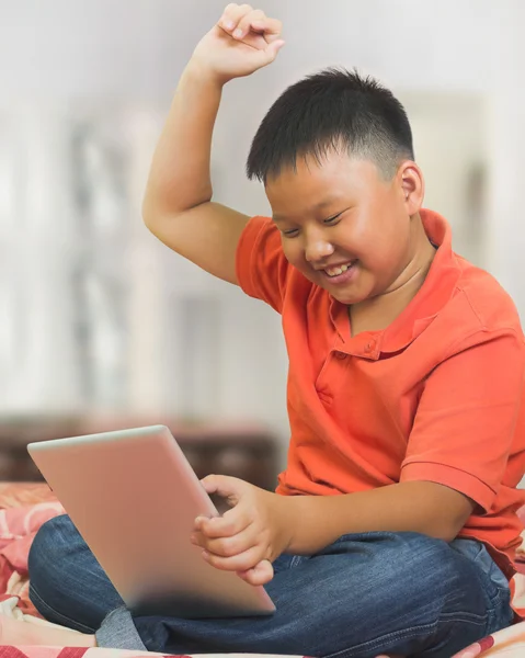 Young asian boy with a a graphic tablet — Stock Photo, Image