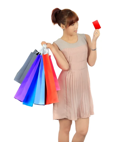 Mujer asiática joven aislada con bolsas de compras coloridas — Foto de Stock