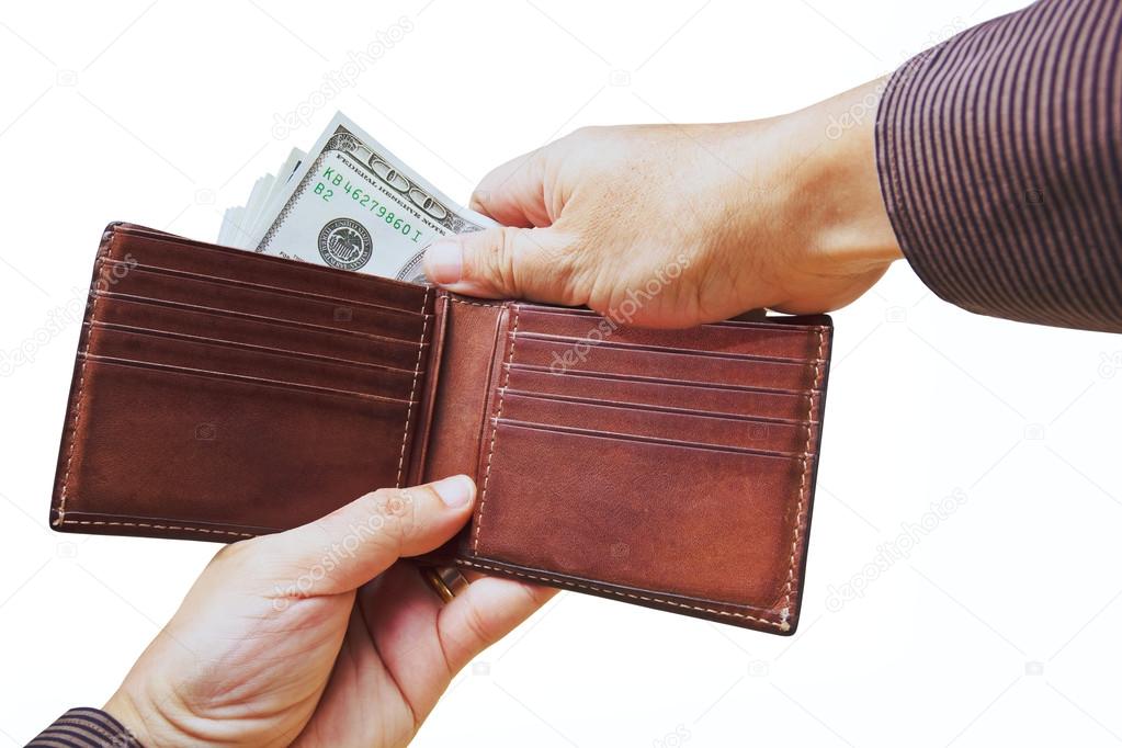 Isolated of hands taking out cash to spend