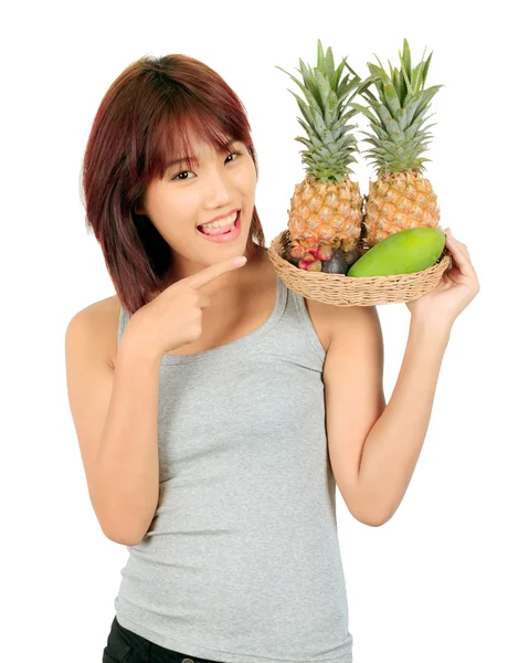 Isolato giovane donna asiatica con varietà di frutti orientali . — Foto Stock